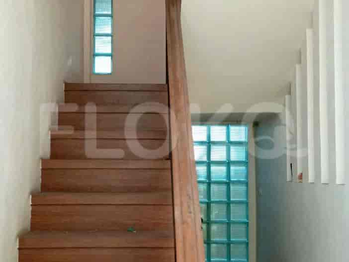 A staircase with wooden steps and a wooden railing.