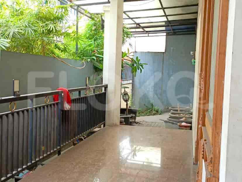 A balcony with metal railings and a view of the outdoor area.