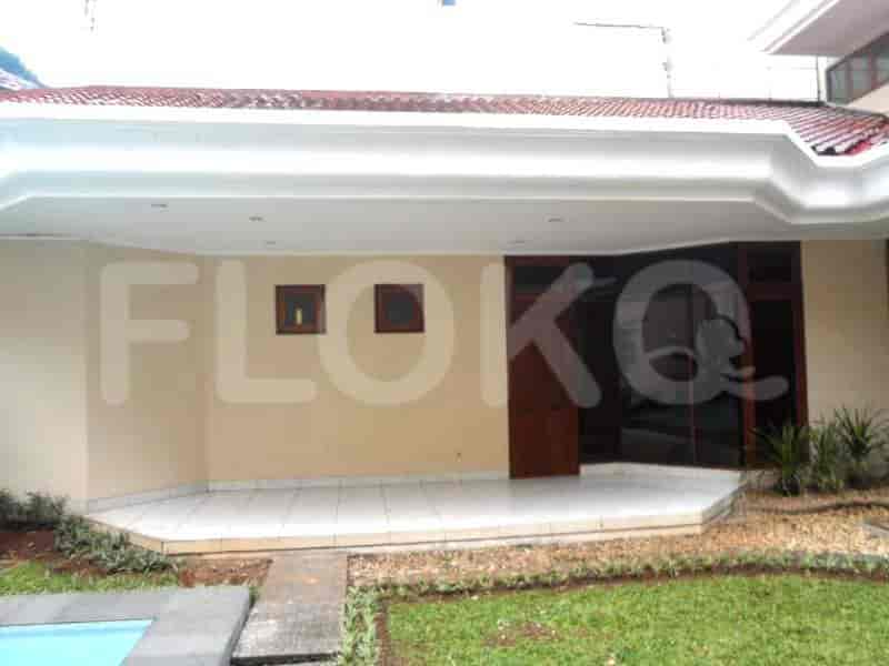 A patio area with access to a swimming pool and a covered outdoor area.