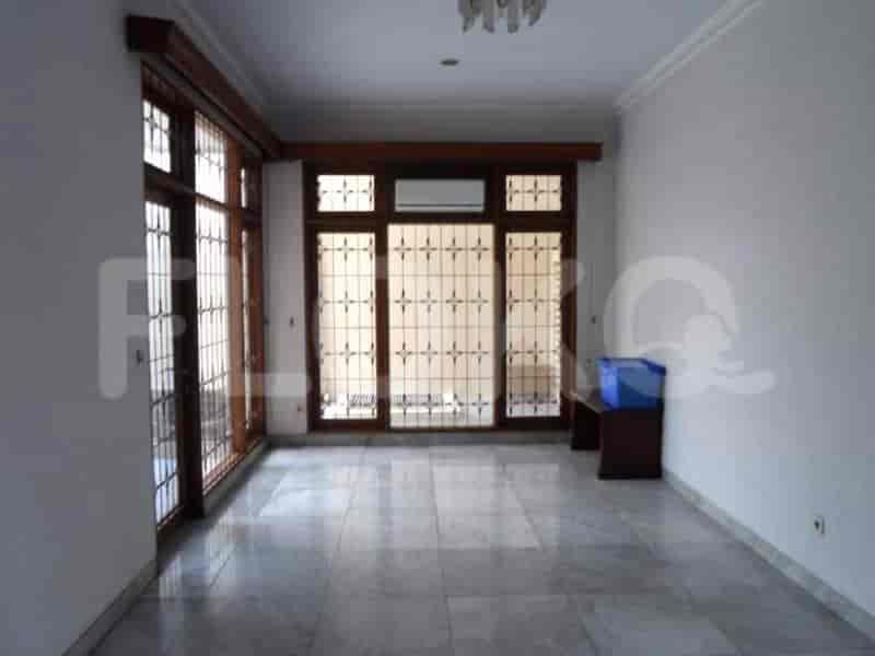 An open living space with large windows, offering natural light and a view.