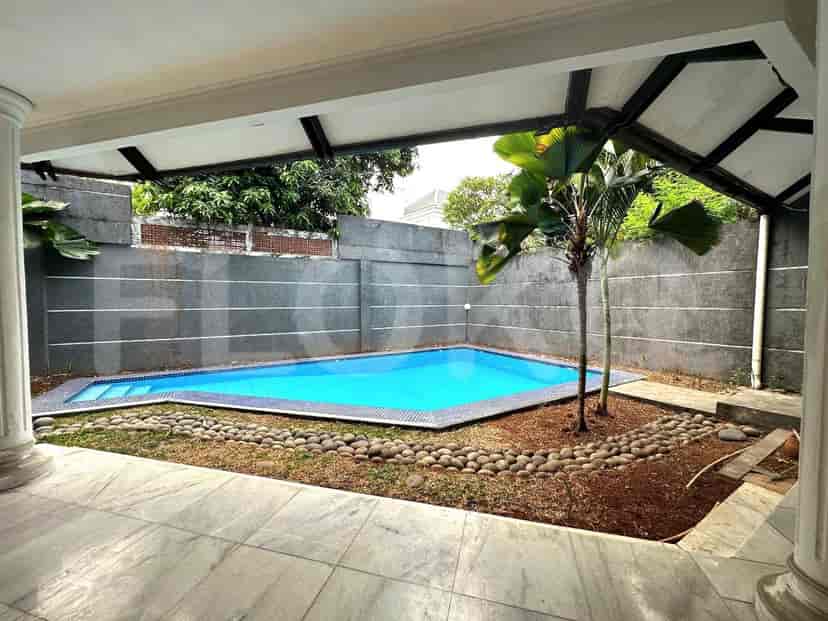 The exterior of the house features a swimming pool.