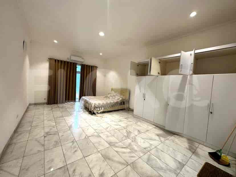 Large bedroom with wardrobe and bed.