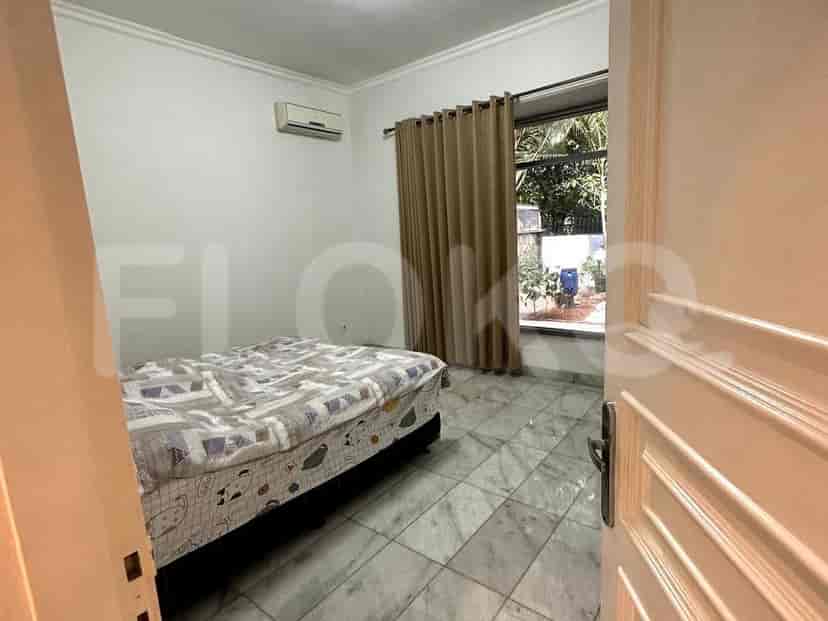 Bedroom with a double bed and curtains.