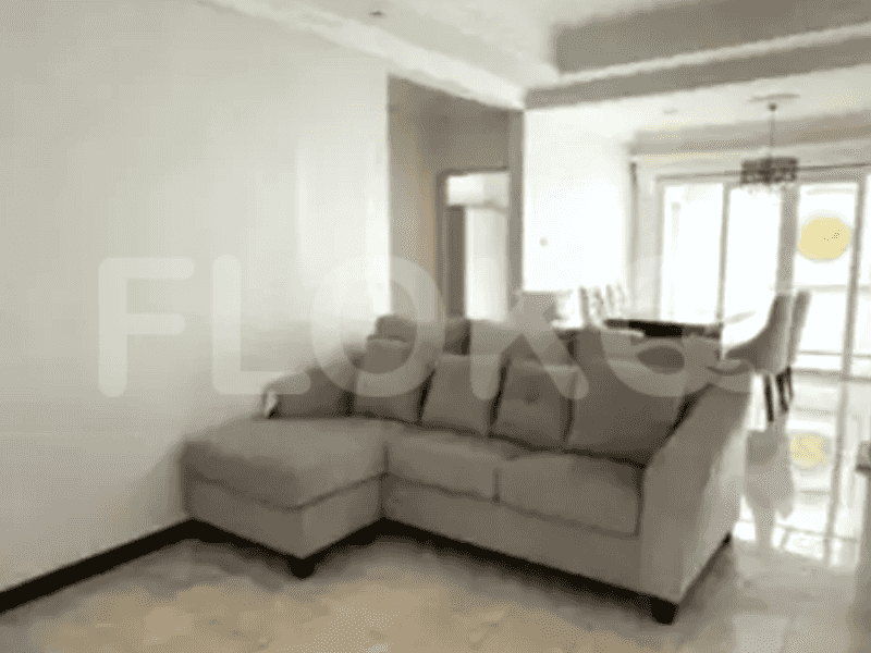 A living room with an L-shaped grey sofa.
