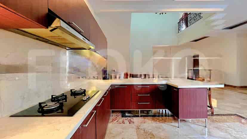 A modern kitchen with sleek cabinetry, a gas stove, and a large island.