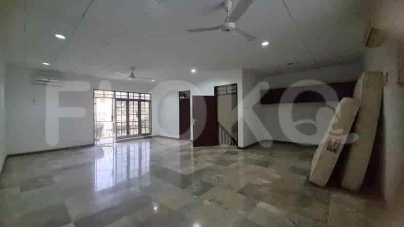 A large living room with marble flooring, ceiling fans, and access to the balcony.