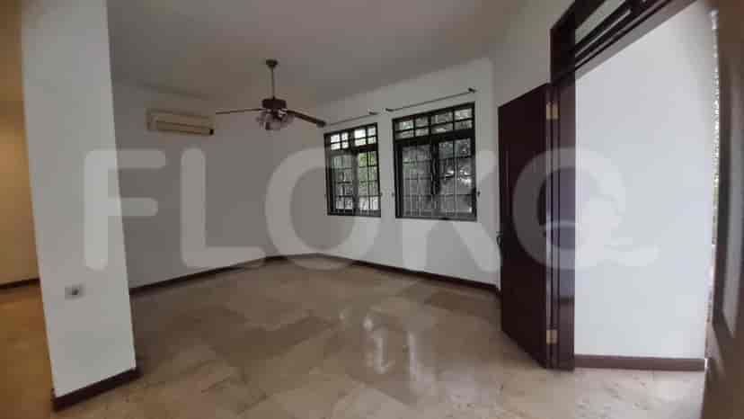 A bedroom with marble flooring, ceiling fan, and windows.