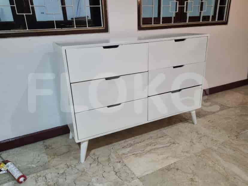 A white dresser with six drawers.