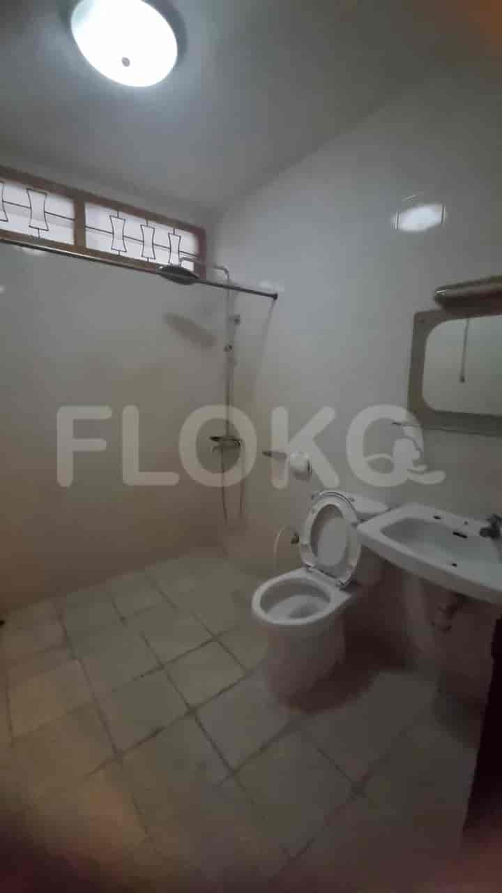 A bathroom with a toilet, a sink, and a shower.