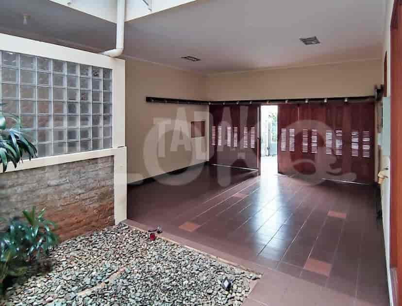 A garage with stone-covered flooring.