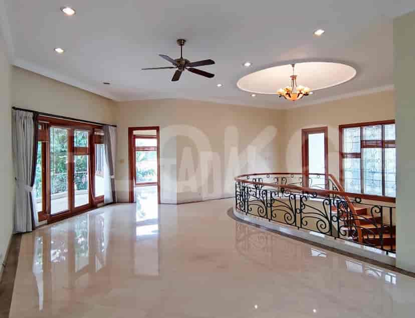 A living room area featuring a chandelier, ceiling fan, and a spiral staircase.