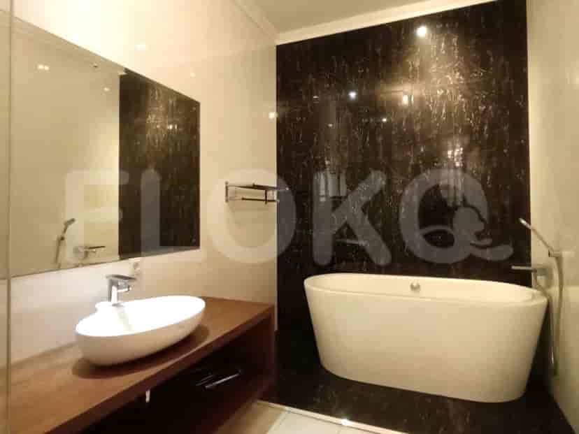 A modern bathroom with a standalone bathtub, vanity with a vessel sink, and a large mirror.