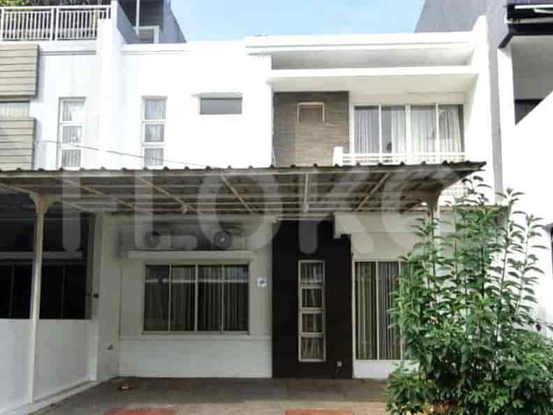 Exterior view of a modern two-story house with a carport, a covered balcony, and a small garden.