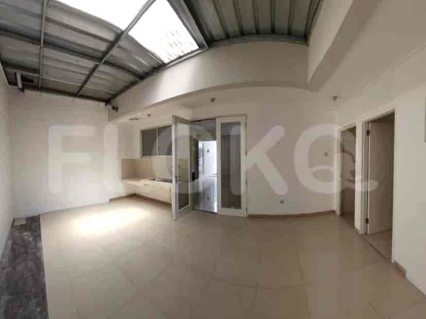 A kitchen with a tiled floor and a view to outside.