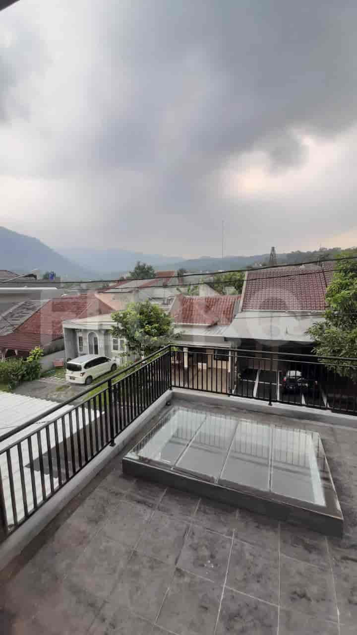 A rooftop terrace with a glass skylight and a scenic view.
