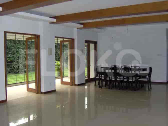 Another view of the dining room, showing the table and chair setting with the view to the garden.