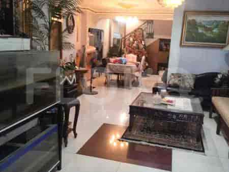 A spacious living room with a dining area and furniture.