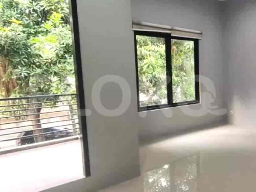 A bright and airy bedroom with large windows and a balcony access