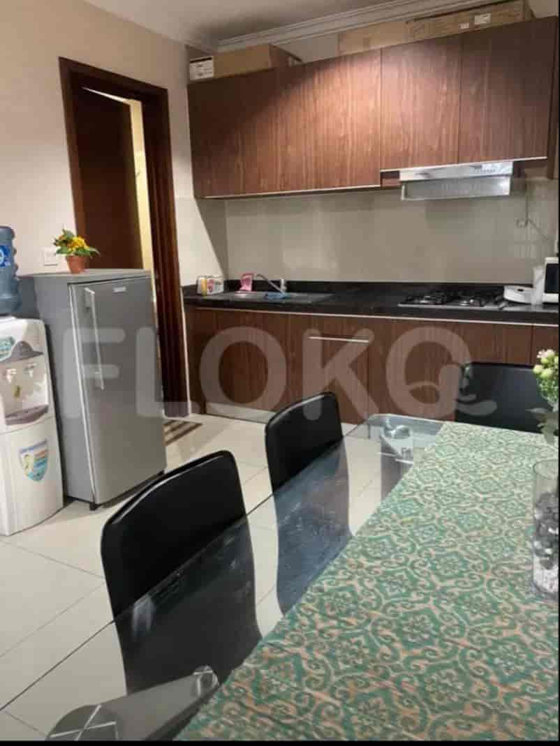 A well-equipped kitchen with wooden cabinets and a dining area.