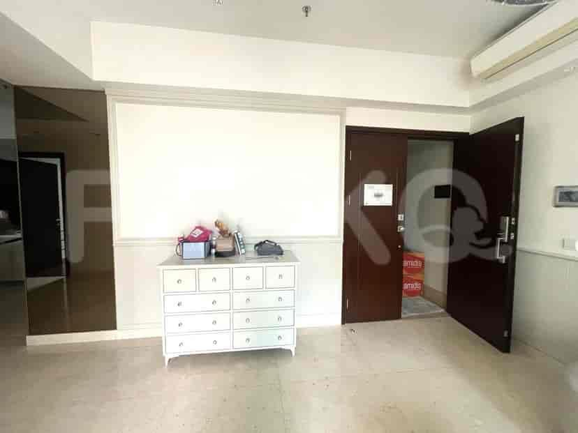 An entryway with a chest of drawers and access to other rooms.