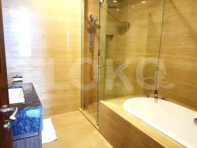 Luxurious bathroom with a glass-enclosed shower and a bathtub.