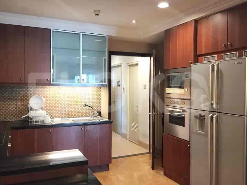 A kitchen with wooden cabinets, modern appliances, and ample counter space.