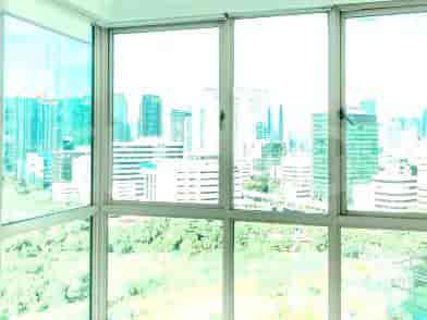 A view of the city through the apartment windows.