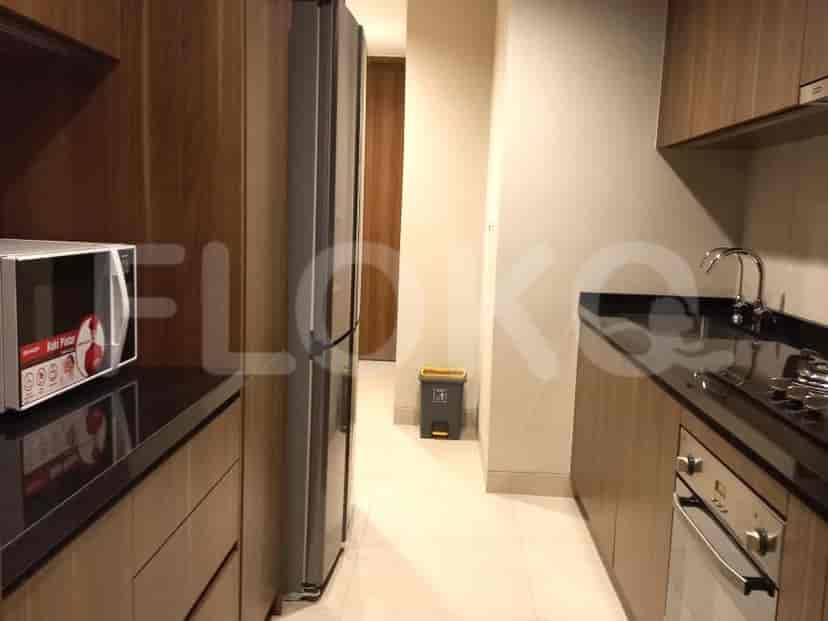 Modern kitchen with appliances and storage.