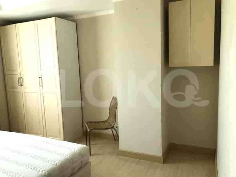 Bedroom with wardrobe and a chair.