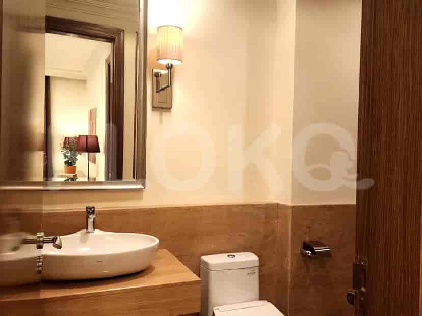 A small and simple bathroom with a sink and toilet.