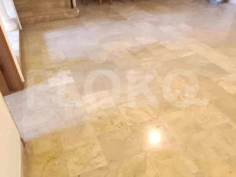 Hallway with marble flooring.