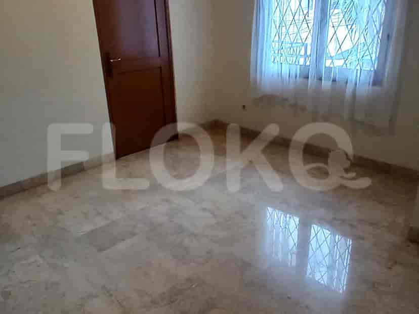 An empty room with marble flooring.