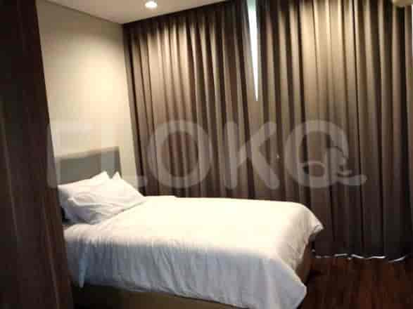 Bedroom with a bed and curtains.