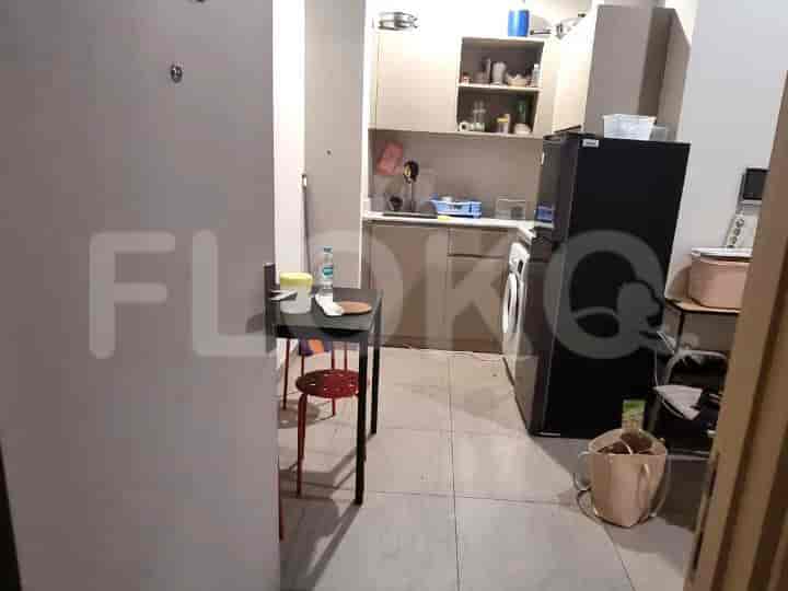 A compact kitchen with a small table.