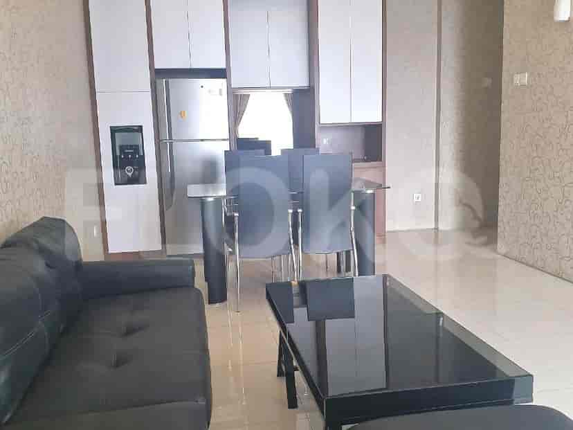 Open-plan living space with a dining area and kitchen.