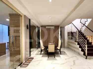 A dining room with a dining table, chairs, and marble flooring.