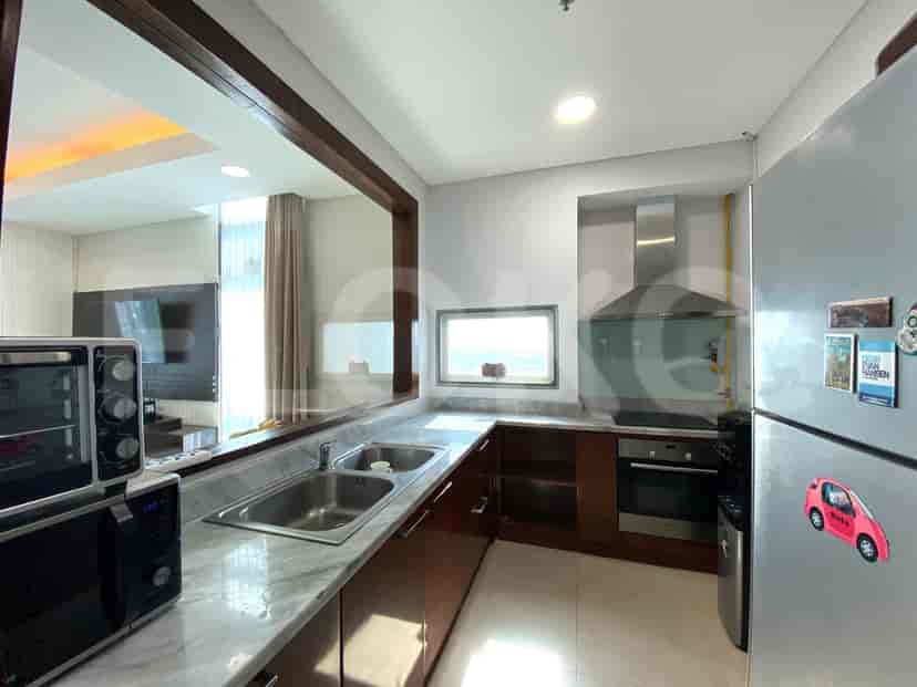 Modern kitchen with a microwave, stainless steel appliances, and a view.