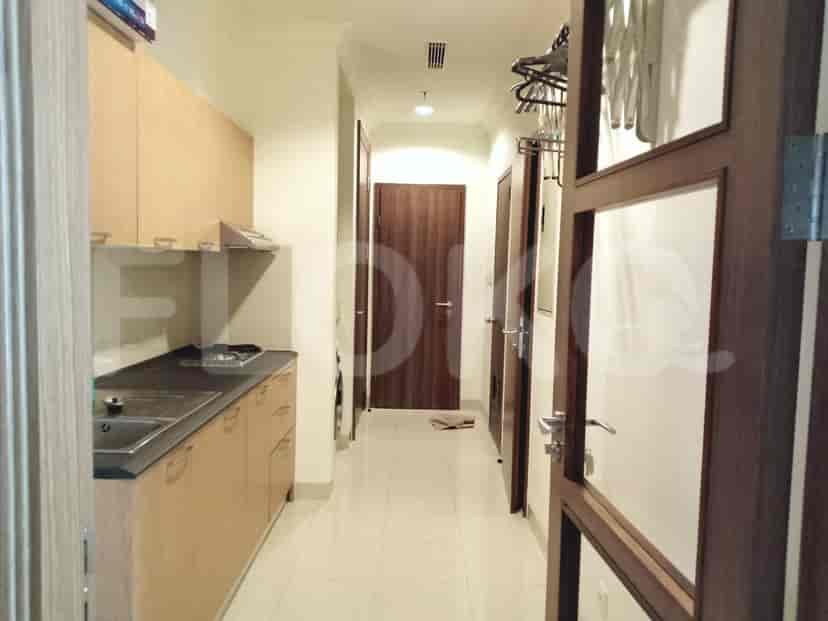 Hallway with small kitchen.