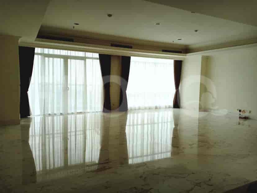 Living room with marble floor, large window and sheer curtains.