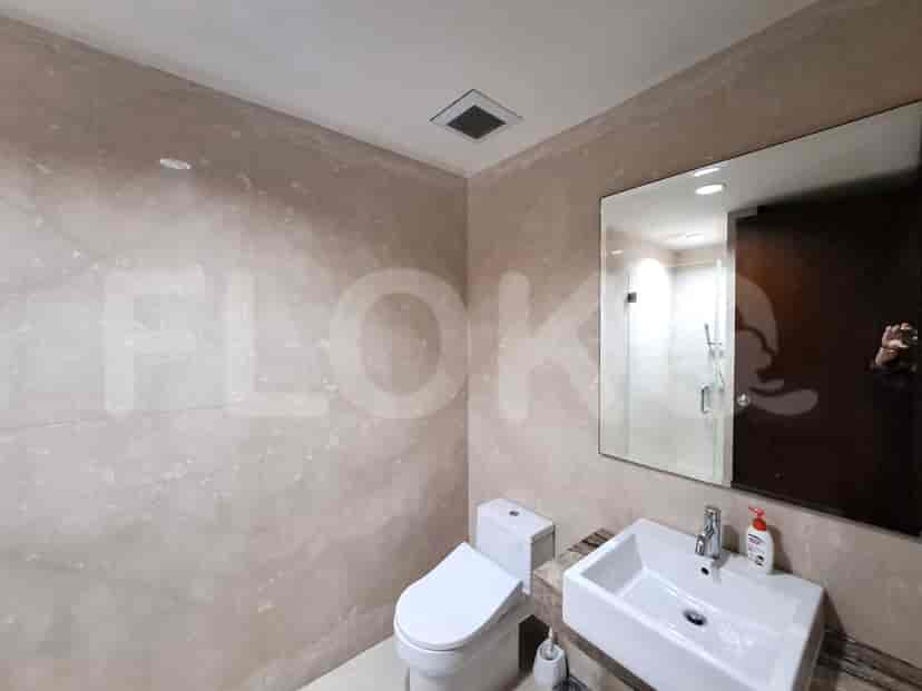 A stylish bathroom with modern fixtures, a sink, and a toilet.