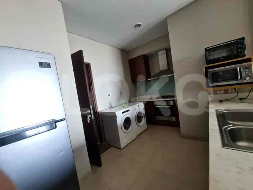 A kitchen area, featuring appliances.