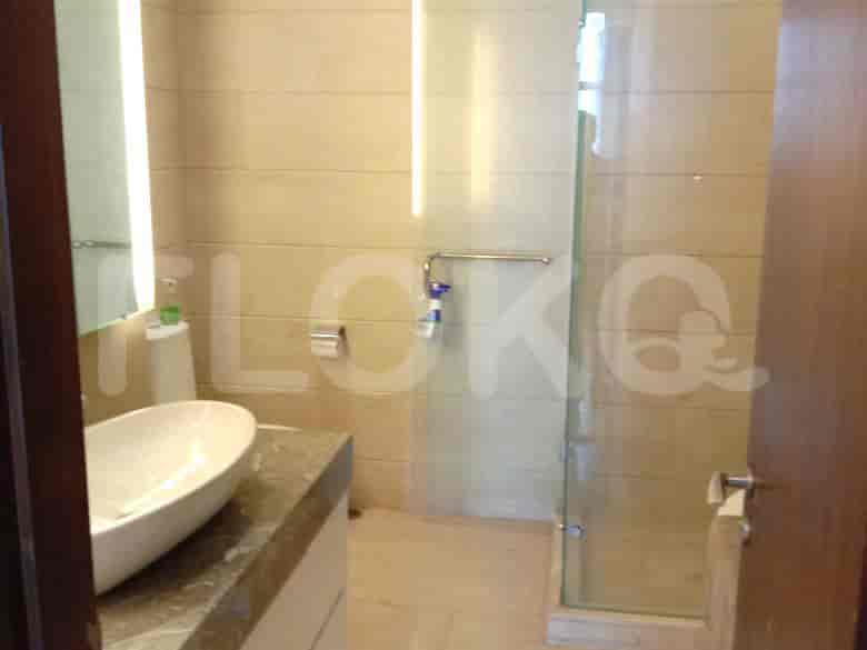 Modern bathroom with a glass shower and sink.