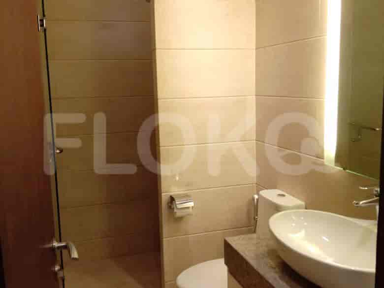 Modern bathroom with a glass shower and sink.