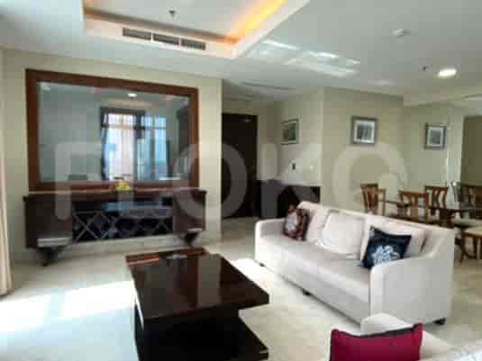 Another view of the living room, showcasing a dining area.