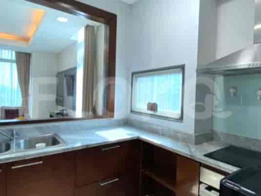 A modern kitchen with appliances and countertops.