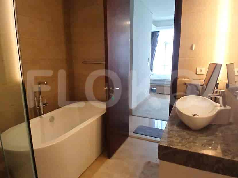 Modern bathroom with a bathtub, sink, and luxurious fixtures.