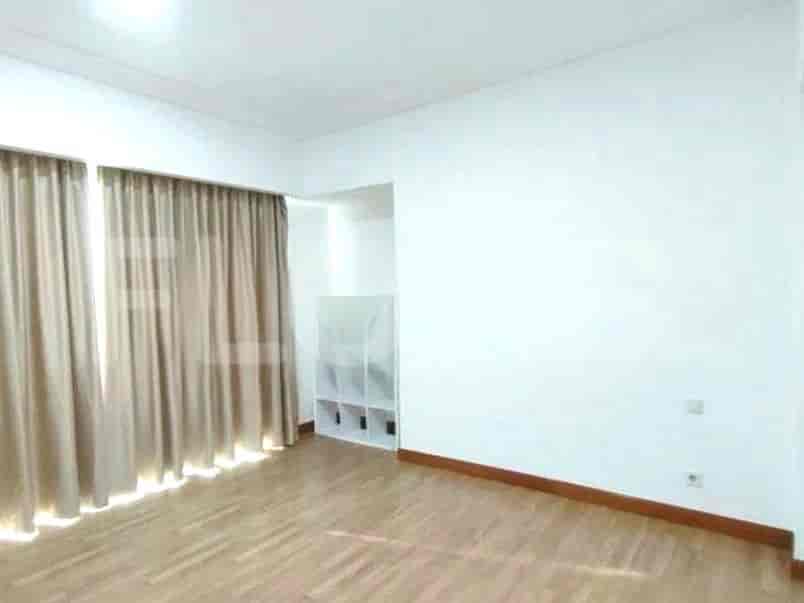 Bedroom with curtains and white walls.