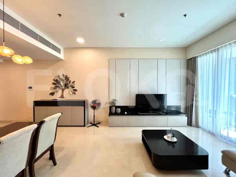 Contemporary living room with TV and stylish decor.