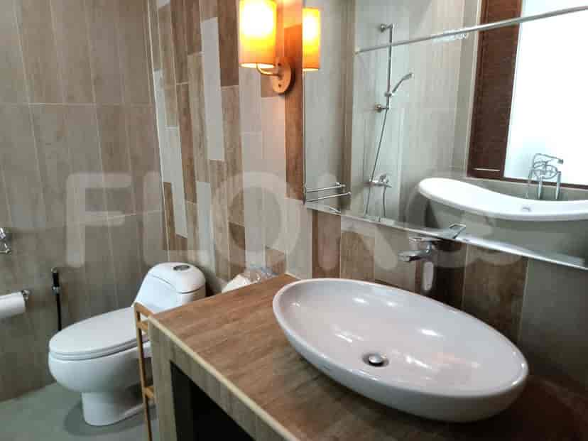 A bathroom with a sink, a toilet, and a bathtub.