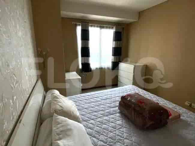 Bedroom with a double bed, bedside tables, and a neutral color scheme.